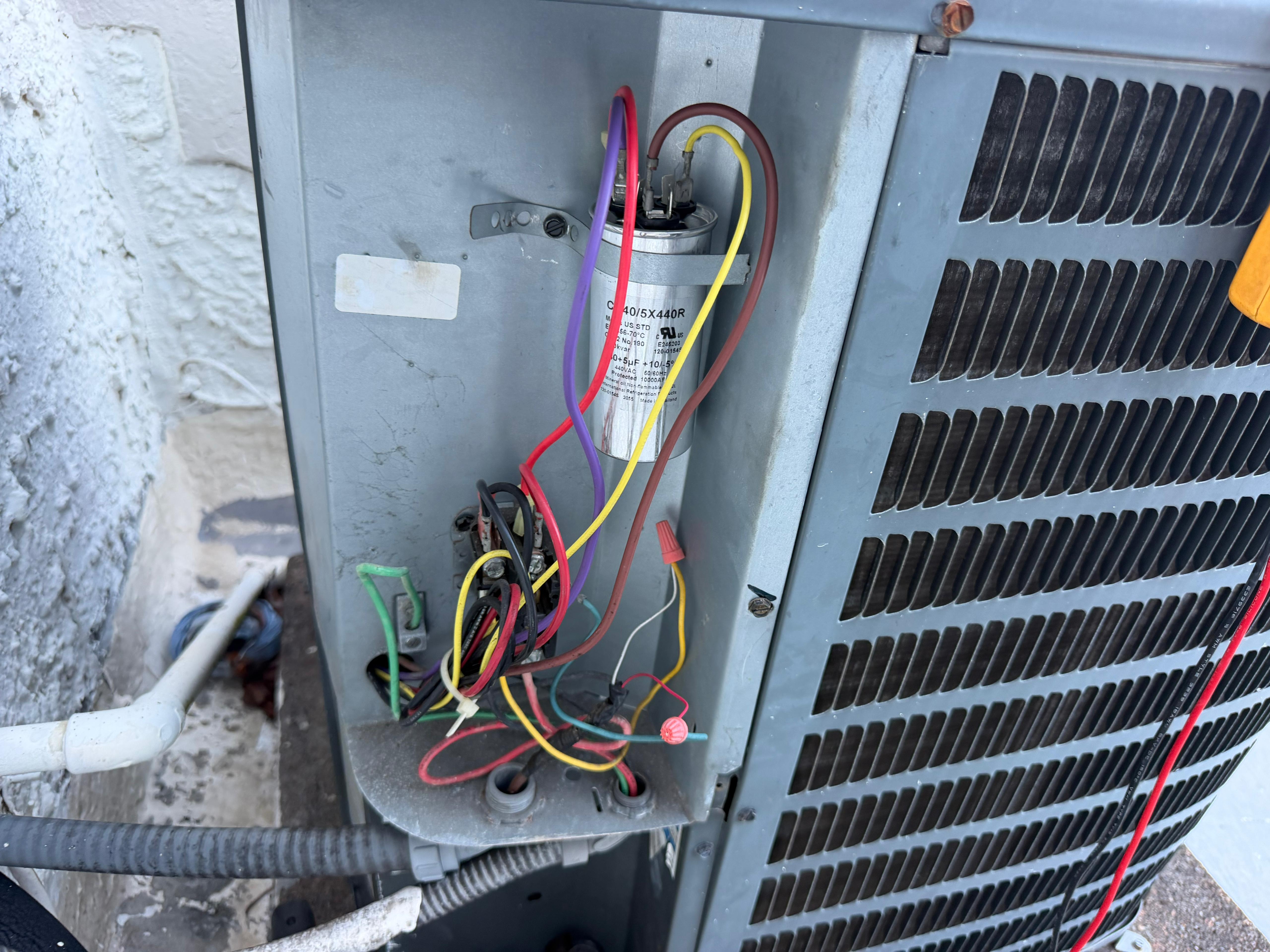 Capacitor and wiring inside condenser unit — Cooling Masters electrical inspection